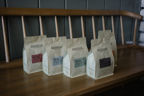 HoneyCo bags lined up across the bench