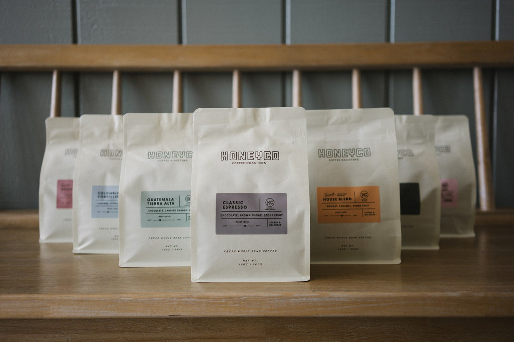 The HoneyCo coffee range lined up on a counter