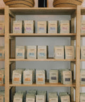 Bags of HoneyCo coffee on the shelf