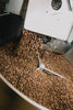 Freshly roasted coffee dropping into the cooling tray