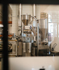 The Loring roaster seen through the window of the HoneyCo roastery in Morro Bay