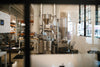 The Loring roaster seen through the window of the HoneyCo roastery in Morro Bay