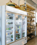 Bags of HoneyCo coffee and goods on the shelves in Morro Bay