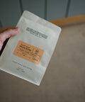Scout House Blend held in hand