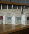 A row of HoneyCo kilo bags