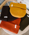 Scout Beanies in Gold, Brown, Rust and Green, laid flat