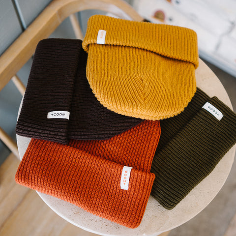 Scout Beanies in Gold, Brown, Rust and Green, laid flat