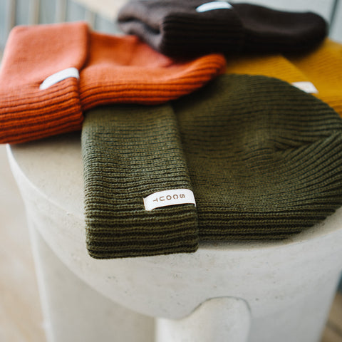 Woven Scout label on the cuff of the Scout Beanie in Gold, Brown, Rust and Green